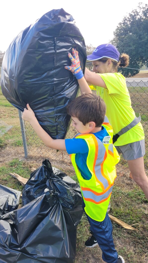 River piling up bags of litter.