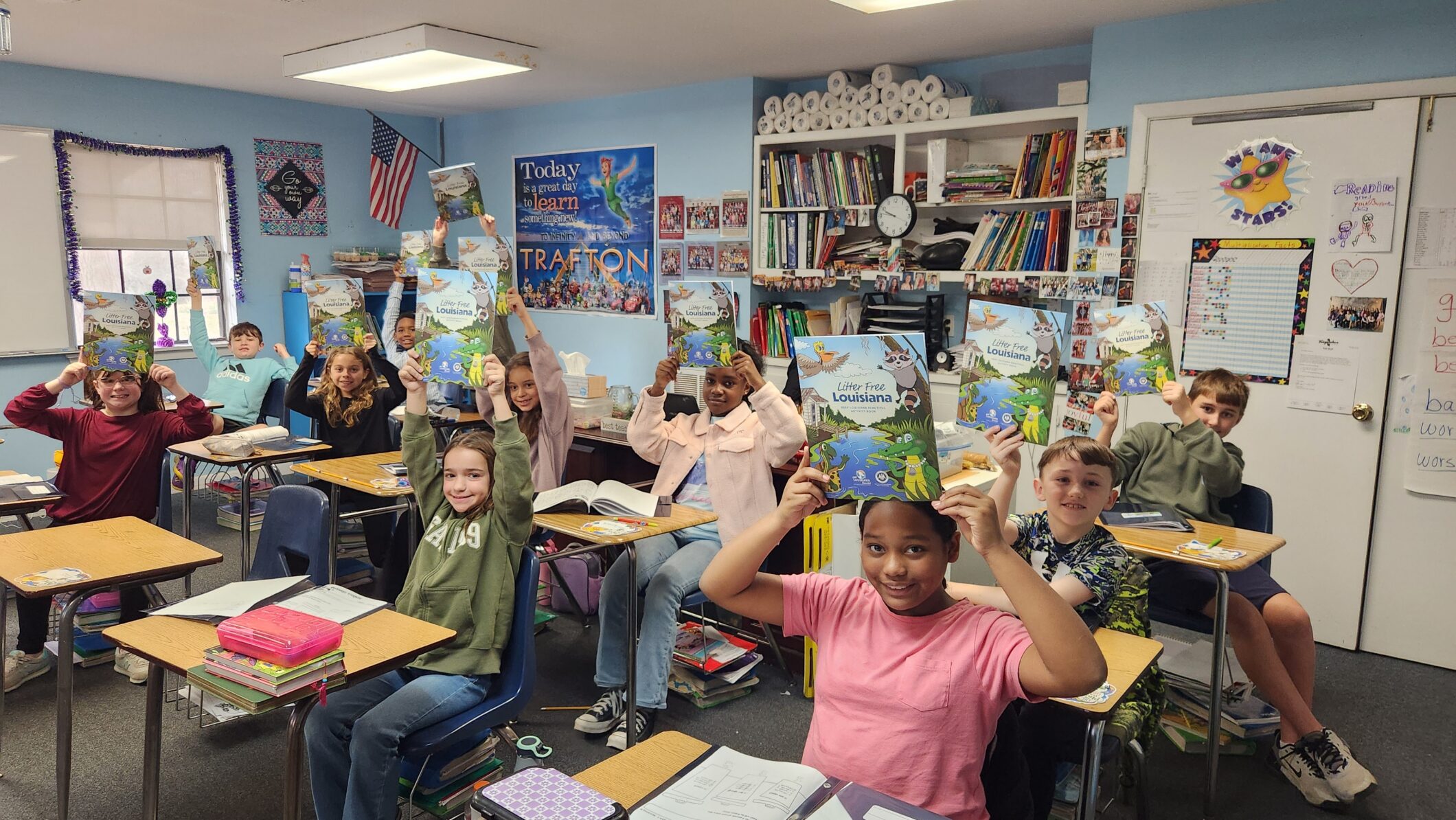 Elementary students with litter-free louisiana activity books
